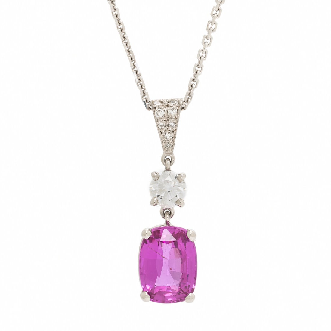 Pink Sapphire and Diamond Pendant Necklace: Pink Sapphire and Diamond Pendant Necklace Set with a cushion cut pink sapphire weighing approximately 4.20 carats by formula, with a round brilliant cut diamond weighing approximately 0.50 carat,