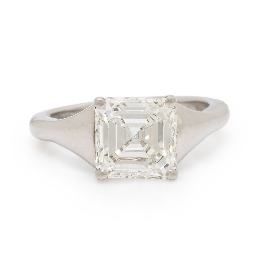 Diamond and Platinum Ring: Diamond and Platinum Ring Featuring a square emerald cut diamond weighing 3.08 carats, set in a mounting with a tapered shank. Mounted in platinum and 14 karat white gold. Ring size 7 3/4. Stamp: 3 FM