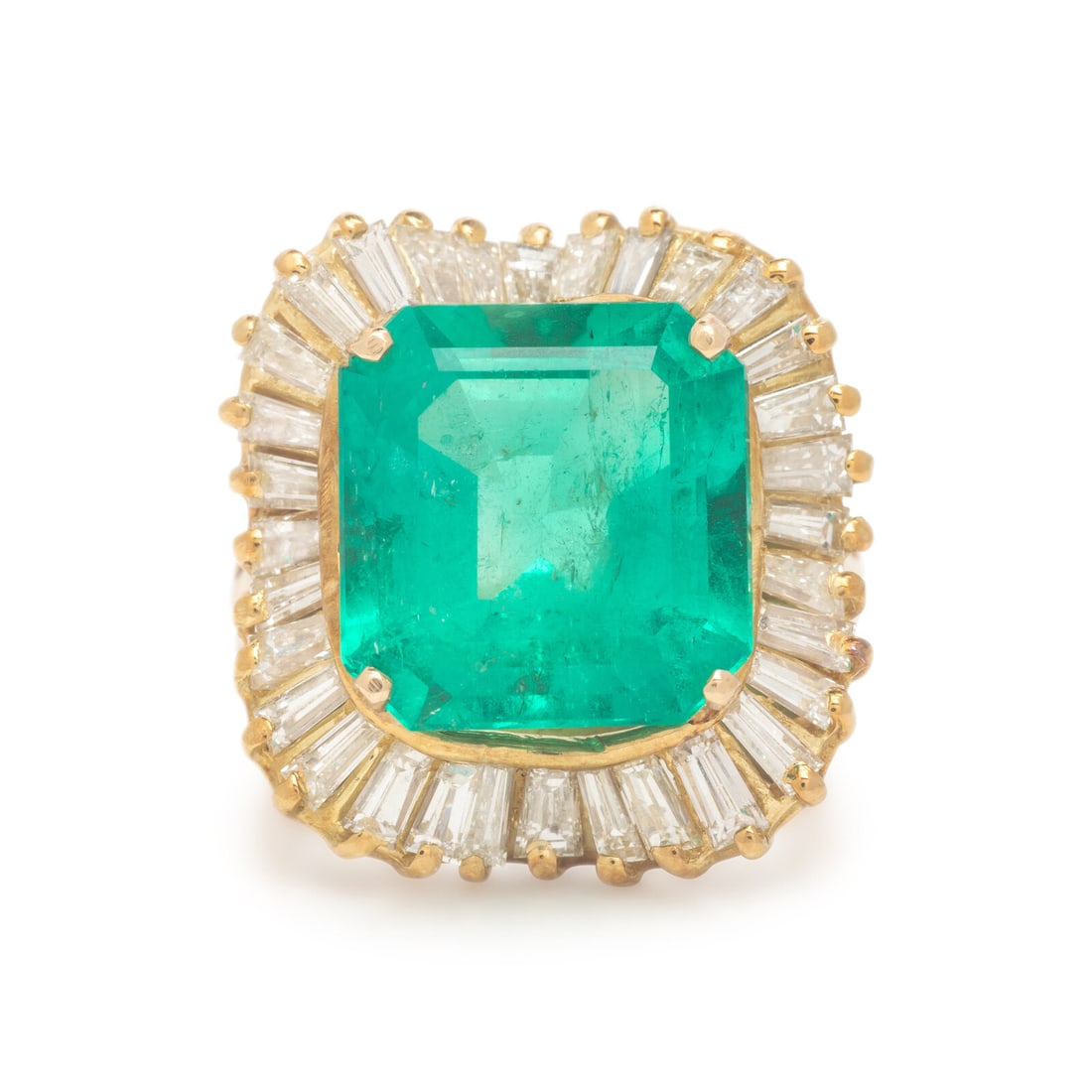 Colombian Emerald, Diamond, and Yellow Gold Ring: Colombian Emerald, Diamond, and Yellow Gold Ring Featuring an emerald cut emerald weighing approximately 6.90 carats by formula, surrounded by tapered baguette cut diamonds weighing approximately 1.10