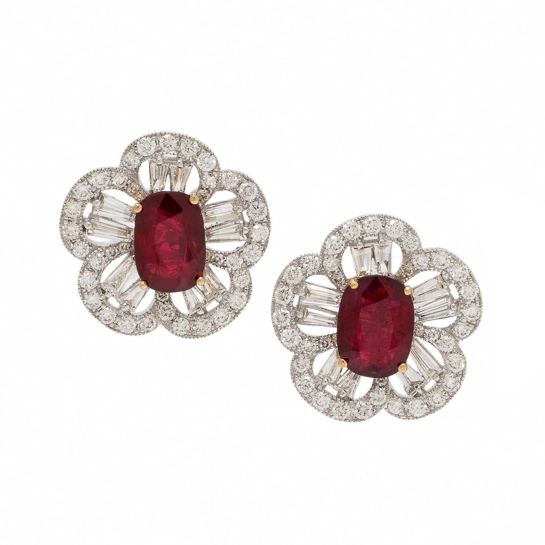 Burmese Ruby and Diamond Flower Earrings: Burmese Ruby and Diamond Flower Earrings In a floral design, set with two cushion cut Burmese rubies weighing approximately 1.00 carat and 1.12 carats respectively, surrounded by round brilliant and