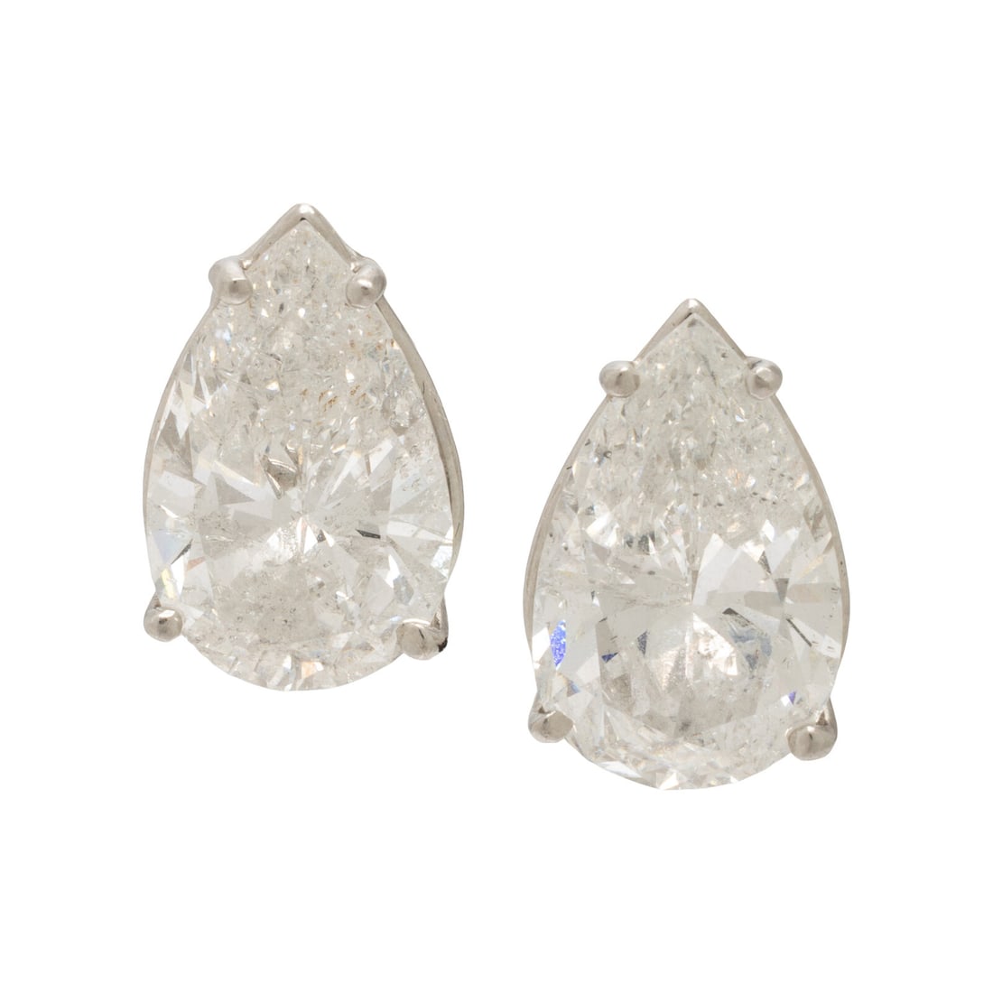 Diamond and Platinum Stud Earrings: Diamond and Platinum Stud Earrings Set with two pear shape diamonds weighing approximately 5.00 and 5.20 carats respectively. Mounted in platinum. 5/8 inch long. Stamp: (maker's mark) PT950. Gross