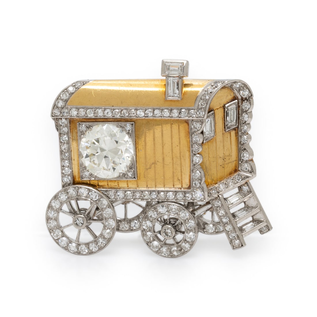 Yellow Gold, Platinum, and Diamond Caboose Brooch: Yellow Gold, Platinum, and Diamond Caboose Brooch Designed as a rail caboose with rotating wheels, featuring a transitional cut diamond weighing approximately 1.60 carats, and set with additional sing