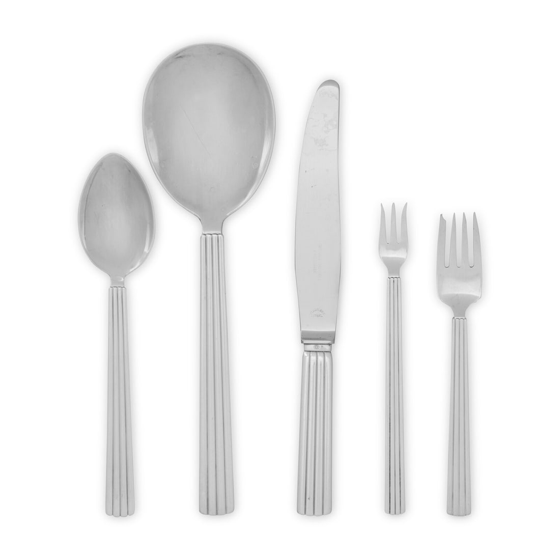A Georg Jensen Bernadotte Silver Flatware Service: A Georg Jensen Bernadotte Silver Flatware Service Designed Sigvard Bernadotte, Copenhagen, Mid-20th Century comprising: 3 dinner forks, 7 1/2 inches 12 luncheon forks, 7 inches 10 salad or fish forks 