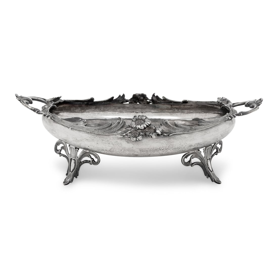 A German Silver Footed Centerpiece Bowl: A German Silver Footed Centerpiece Bowl Henninger and Co., 19th/20th Century marked with the '900' standard to the underside 20 ozt 1 dwt Height 4 1/2 x width 14 1/4 x depth 9 1/2 inches. This lot is