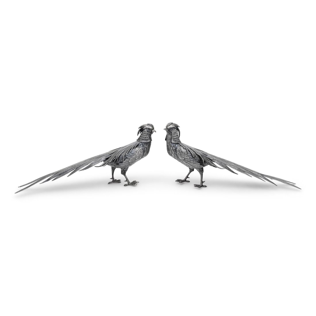A Pair of Spanish Silver Pheasant Table Ornaments: A Pair of Spanish Silver Pheasant Table Ornaments 20th Century each marked 'Sterling' underfoot 19 ozt 13 dwt Height 7 x width 14 1/2 x depth 3 inches. Property from an Important Private Collection,