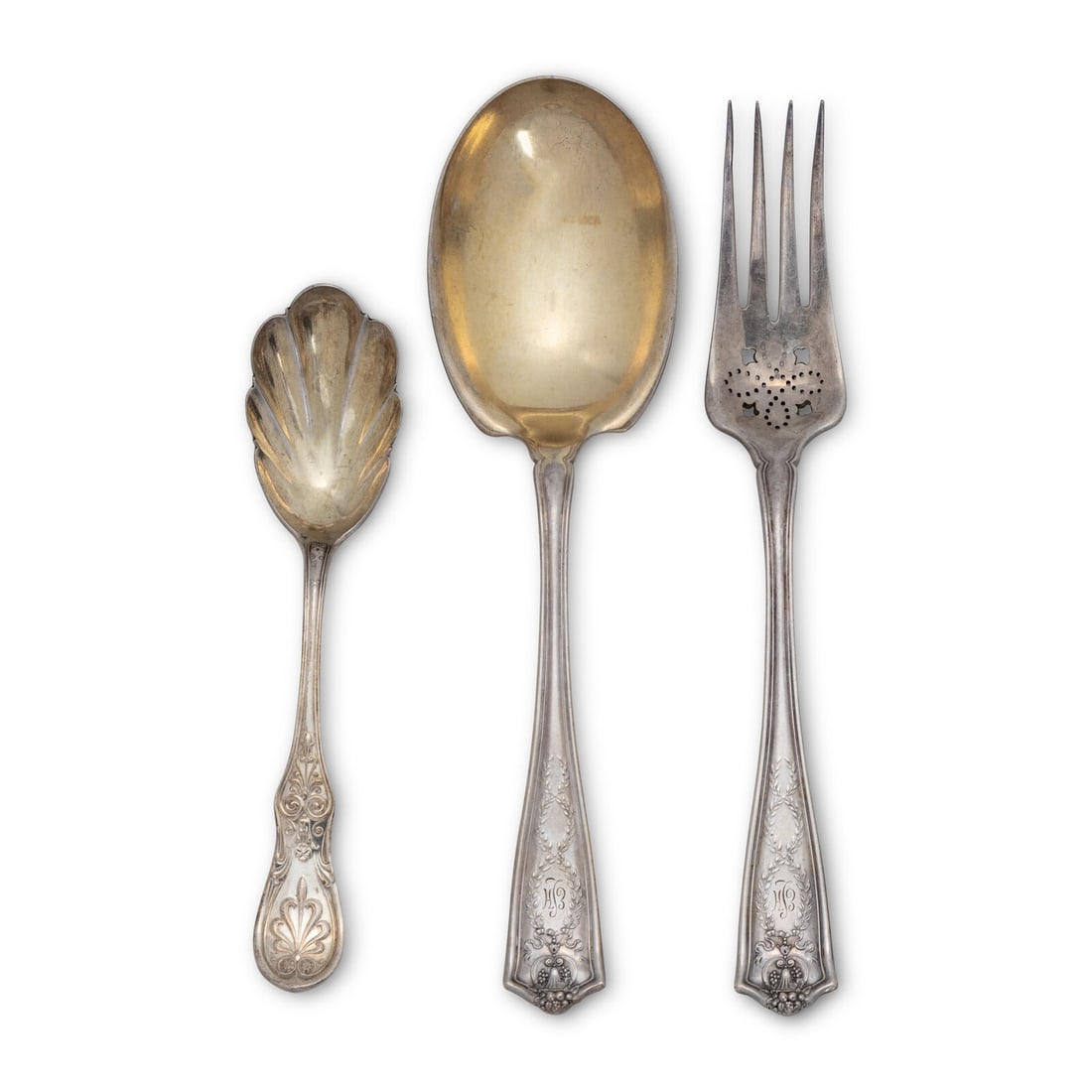 Three Tiffany and Co. Silver Serving Articles: Three Tiffany and Co. Silver Serving Articles New York, NY, 20th Century comprising a serving spoon and pierced fork in the Winthrop pattern, and a sugar scoop in the Saratoga pattern. each marked 'St