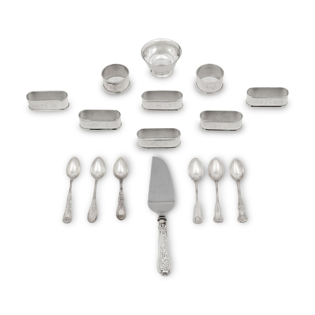A Group of Tiffany and Co. Silver Articles: A Group of Tiffany and Co. Silver Articles comprising a set of six oblong napkin rings, a pair of circular napkin rings, diminutive Revere bowl, a cheese knife, and a set of six coffee spoons (each in