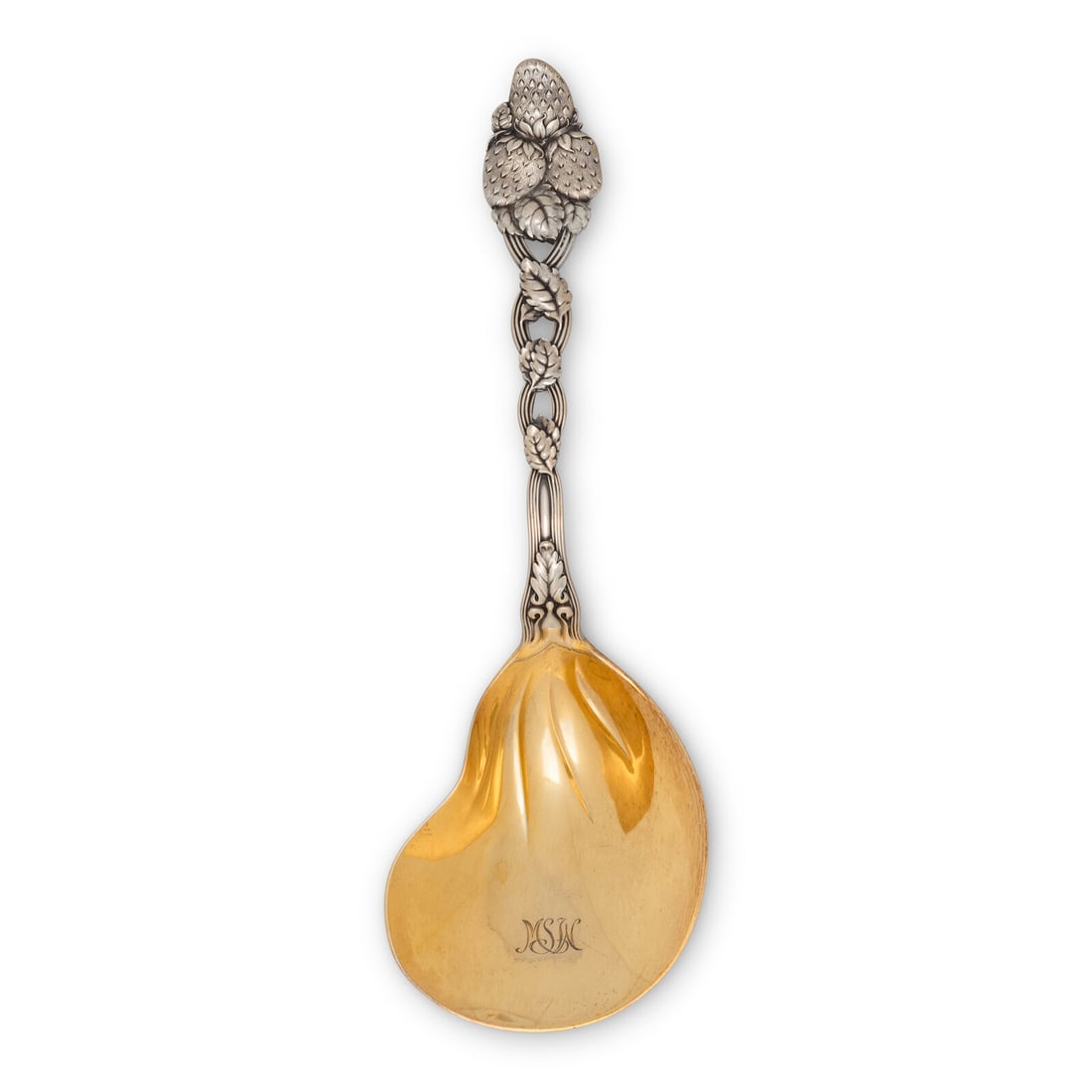 A Tiffany and Co. Silver Serving Spoon: A Tiffany and Co. Silver Serving Spoon New York, NY, 20th Century the vermeil bowl of oyster form; the pierced handle with a strawberry motif. marked 'Sterling' to underside 4 ozt 4 dwt Length 9 1/2 i