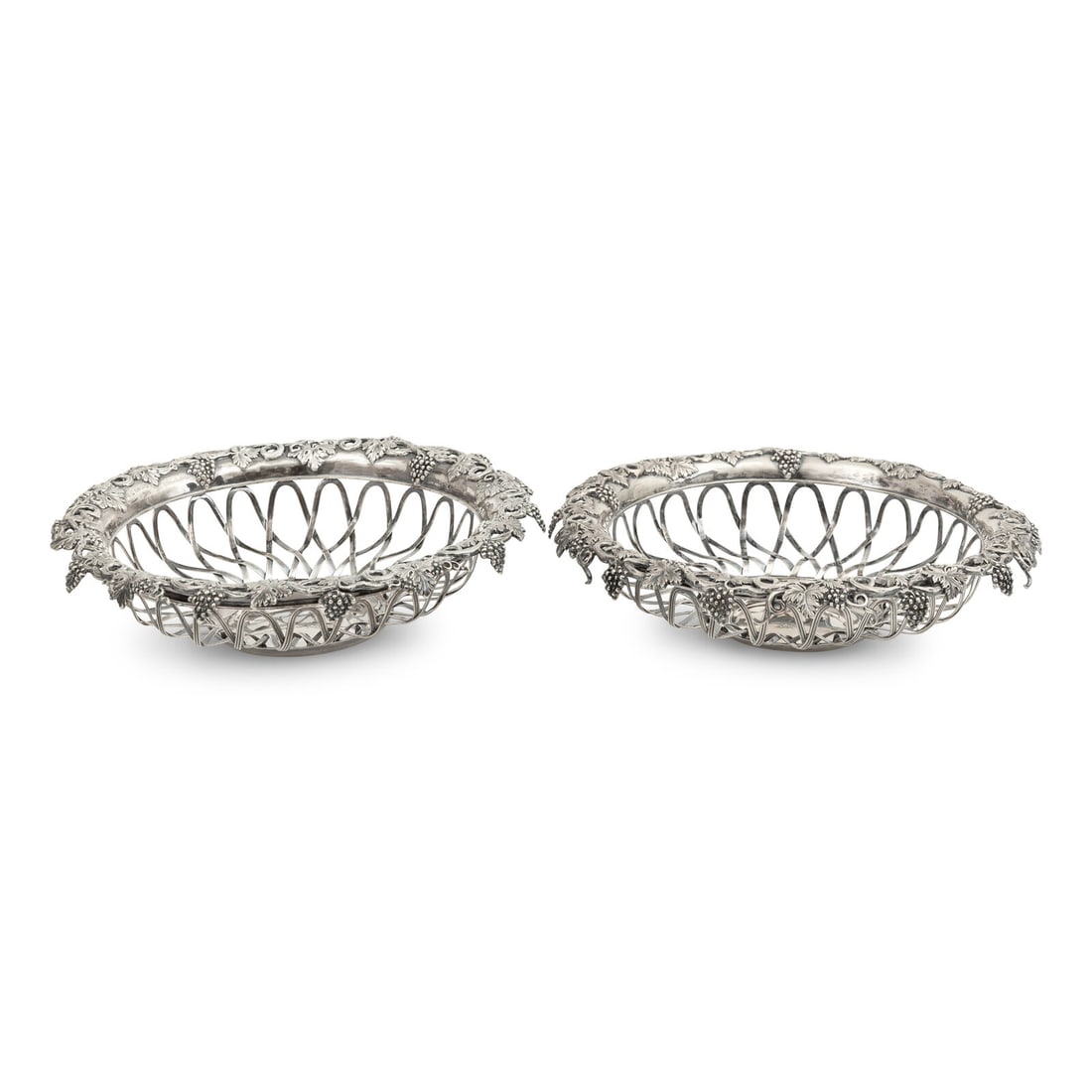 A Pair of William IV Silver Grape Baskets: A Pair of William IV Silver Grape Baskets Birmingham, 1833 one hallmarked MB, possibly for Matthew Boulton; the other with marks rubbed. 31 ozt gross Height 2 1/2 x diameter 10 3/4 inches. This lot