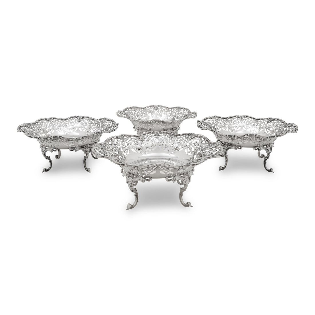 A Set of Four Scottish Edwardian Silver Reticulated Bowls: A Set of Four Scottish Edwardian Silver Reticulated Bowls Smith and Rait, Glasgow, 1905-1906 each hallmarked for sterling to interior 64 ozt 17 dwt gross Height 4 x diameter 9 1/4 inches. This lot is