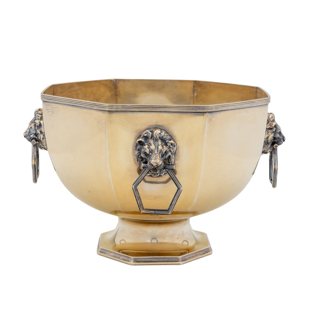 An Edwardian Silver Centerpiece Bowl: An Edwardian Silver Centerpiece Bowl Henry Wifgull, Sheffield, 1909 of octagonal form, with four lion mask handles. hallmarked for Sterling to body 52 ozt 14 dwt Height 8 x diameter 10 inches.