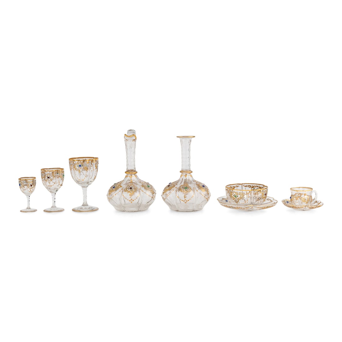 A Venetian Enameled and Gilt Decorated Glass Table Service: A Venetian Enameled and Gilt Decorated Glass Table Service 20th Century comprising: 17 wine stems 8 dessert wine stems 9 cordial glasses 10 coffee cups and 11 saucers 12 dessert bowls and 11 underplat