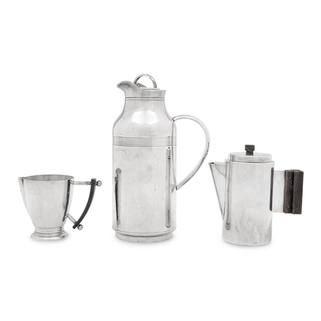 Three Christofle Silver-Plate Coffee Articles: Three Christofle Silver-Plate Coffee Articles 20th Century comprising an insulated carafe, a small coffee pot, and a creamer. Height of first 11 inches. This lot is located in Chicago.