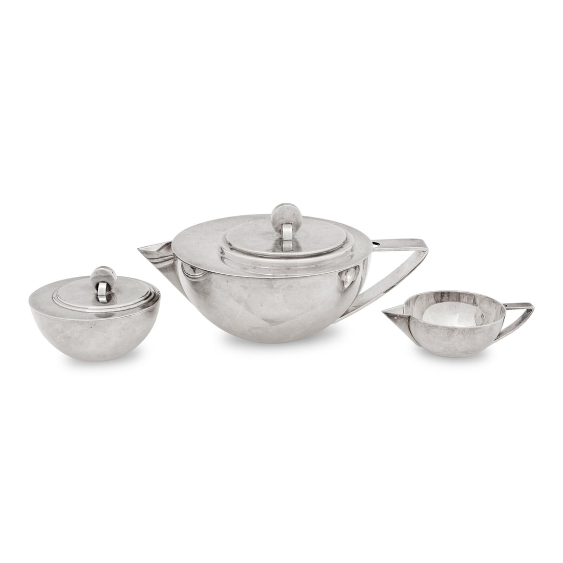 An Ercuis Silver-Plate Three-Piece Tea Service: An Ercuis Silver-Plate Three-Piece Tea Service 20th Century comprising a teapot, creamer and covered sugar. 4 1/4 inches. This lot is located in Chicago.