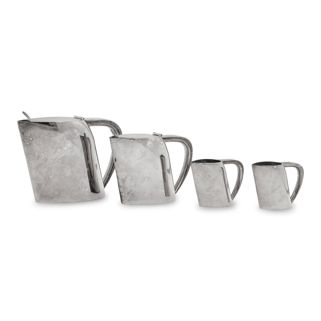 A Group of Four Ercuis Silver-Plate Milk or Cream Pitchers: A Group of Four Ercuis Silver-Plate Milk or Cream Pitchers 20th Century comprising a large example, a medium example, and two smaller examples Height of largest 5 3/4 inches. This lot is located in