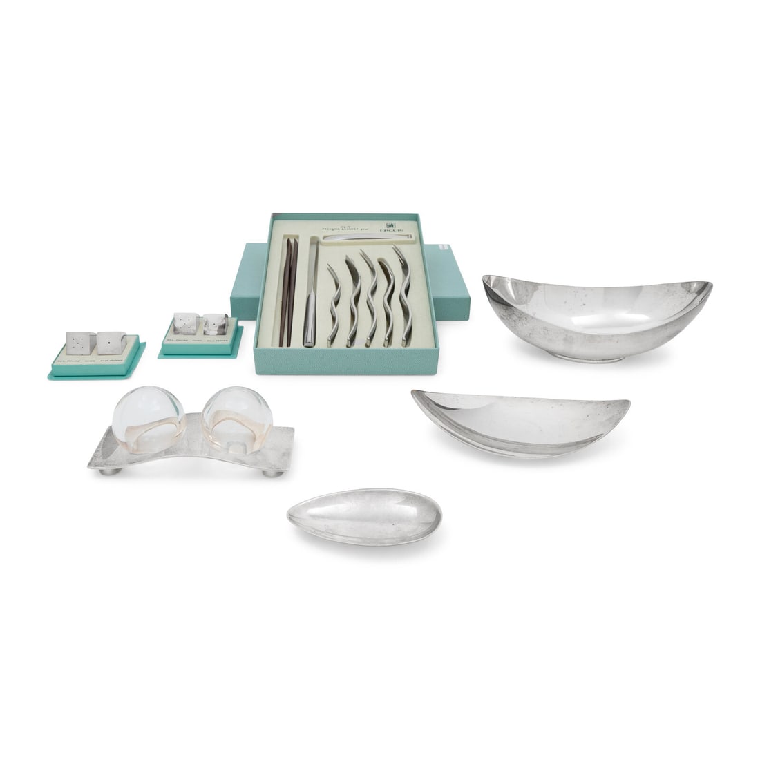 A Group of Ercuis Table Articles: A Group of Ercuis Table Articles 20th Century comprising an oblong bowl, two small shallow dishes, three pairs of casters, and a cased flatware set for one. Height of bowl 3 1/2 x width 10 inches.