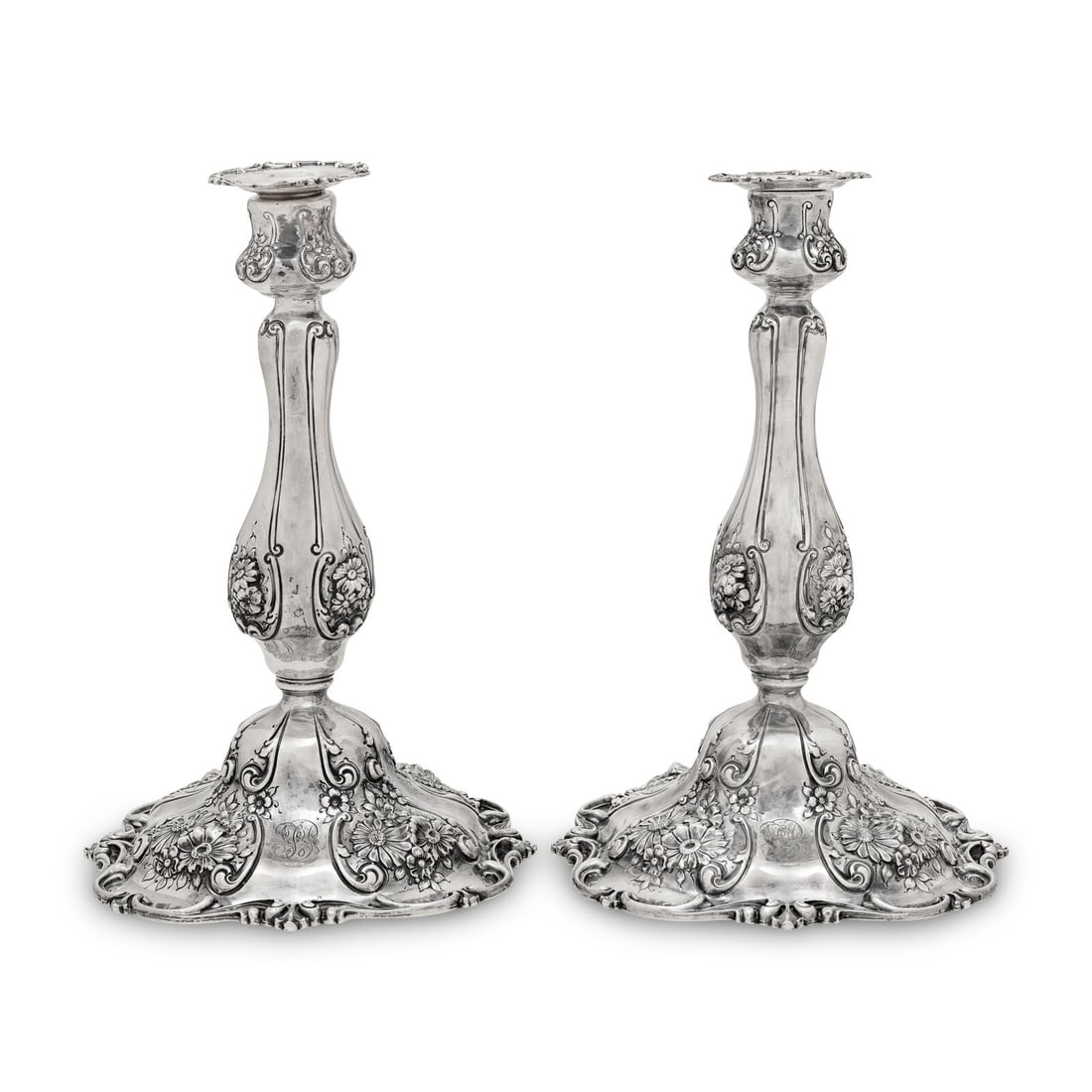 A Pair of American Silver Candlesticks: A Pair of American Silver Candlesticks Theodore B. Starr, Inc., New York, NY, Early 20th Century likely weighted. each marked 'Sterling' to underside Height 10 1/2 inches. This lot is located in