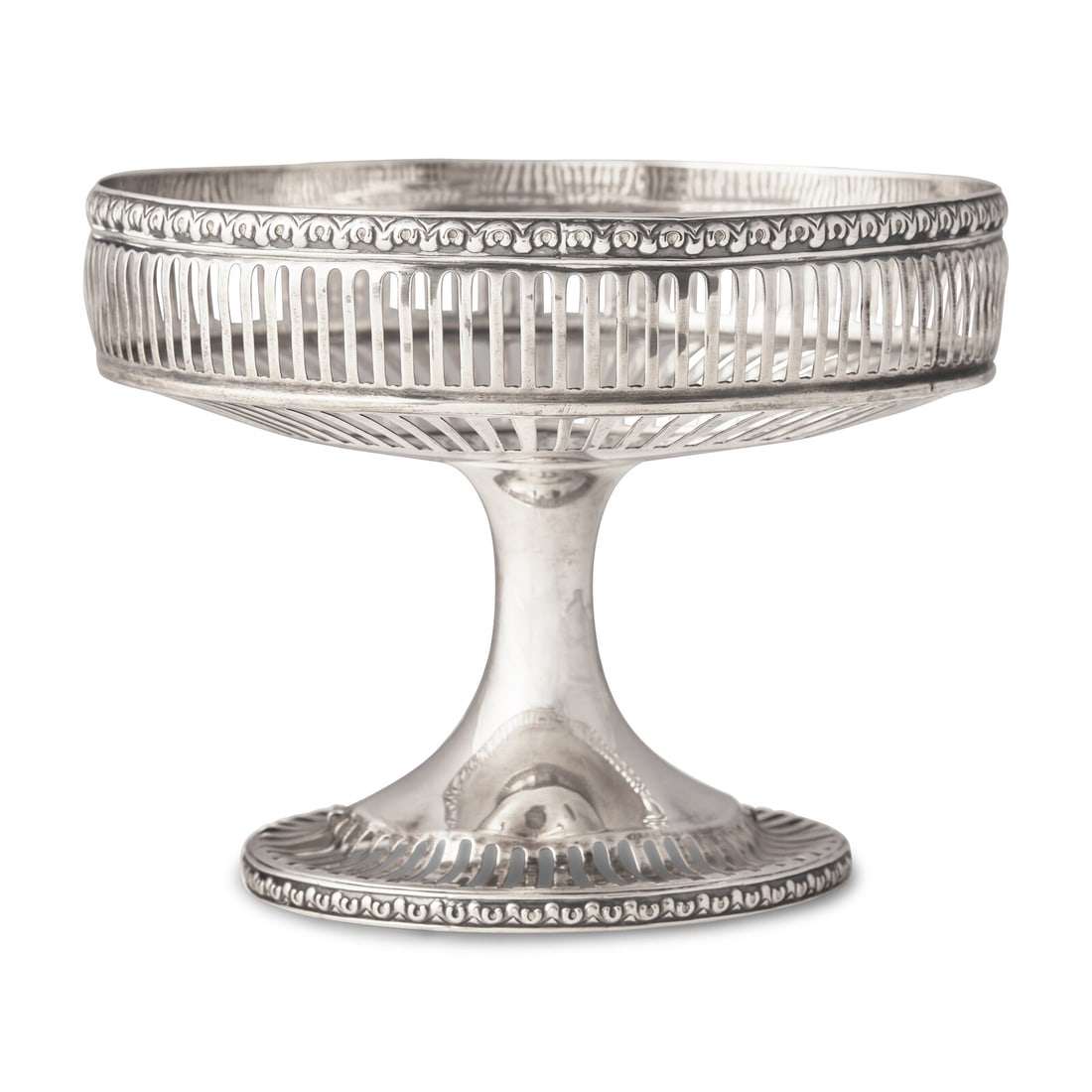 An American Silver Pierced Dessert Stand: An American Silver Pierced Dessert Stand Woodside Co., New York, NY, Circa 1920 centering an engraved monogram JHM. 6 ozt 11 dwt Height 5 x diameter 6 3/8 inches. This lot is located in Philadelphia.
