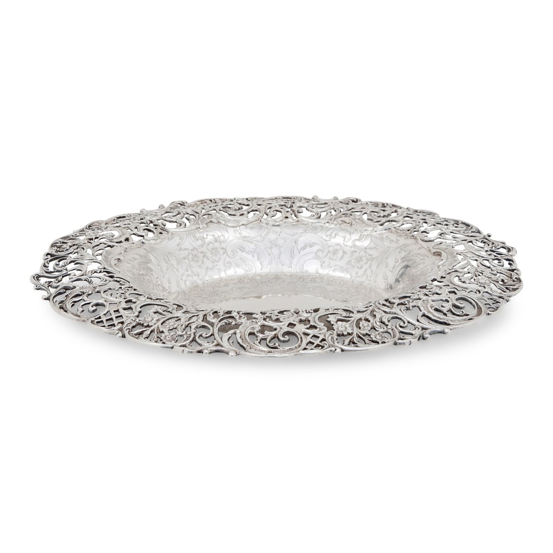 An American Silver Pierced Center Bowl: An American Silver Pierced Center Bowl J.E. Caldwell and Co., Philadelphia, PA, Early 20th Century marked 'Sterling' to underside 24 ozt 3 dwt Length 13 1/4 x width 11 inches. Property from a Midwest
