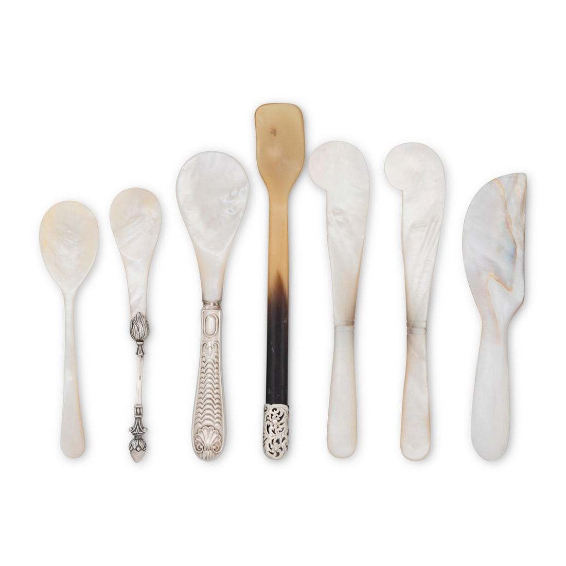 A Group of Caviar Serving Articles: A Group of Caviar Serving Articles Various Makers, 20th Century comprising one silver mounted mother of pearl caviar spoon by Christophe Widman; two mother of pearl caviar spreaders and one caviar