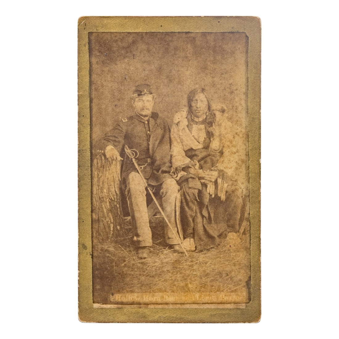 W.R. Cross (American, 1839-1907) Brule Lakota Sioux Chief Hollow Horn Bear with an Unidentified 5th: W.R. Cross (American, 1839-1907) Brule Lakota Sioux Chief Hollow Horn Bear with an Unidentified 5th US Cavalry Second Lieutenant ca 1880 carte de visite CDV on cardstock mount. Verso bears imprint for