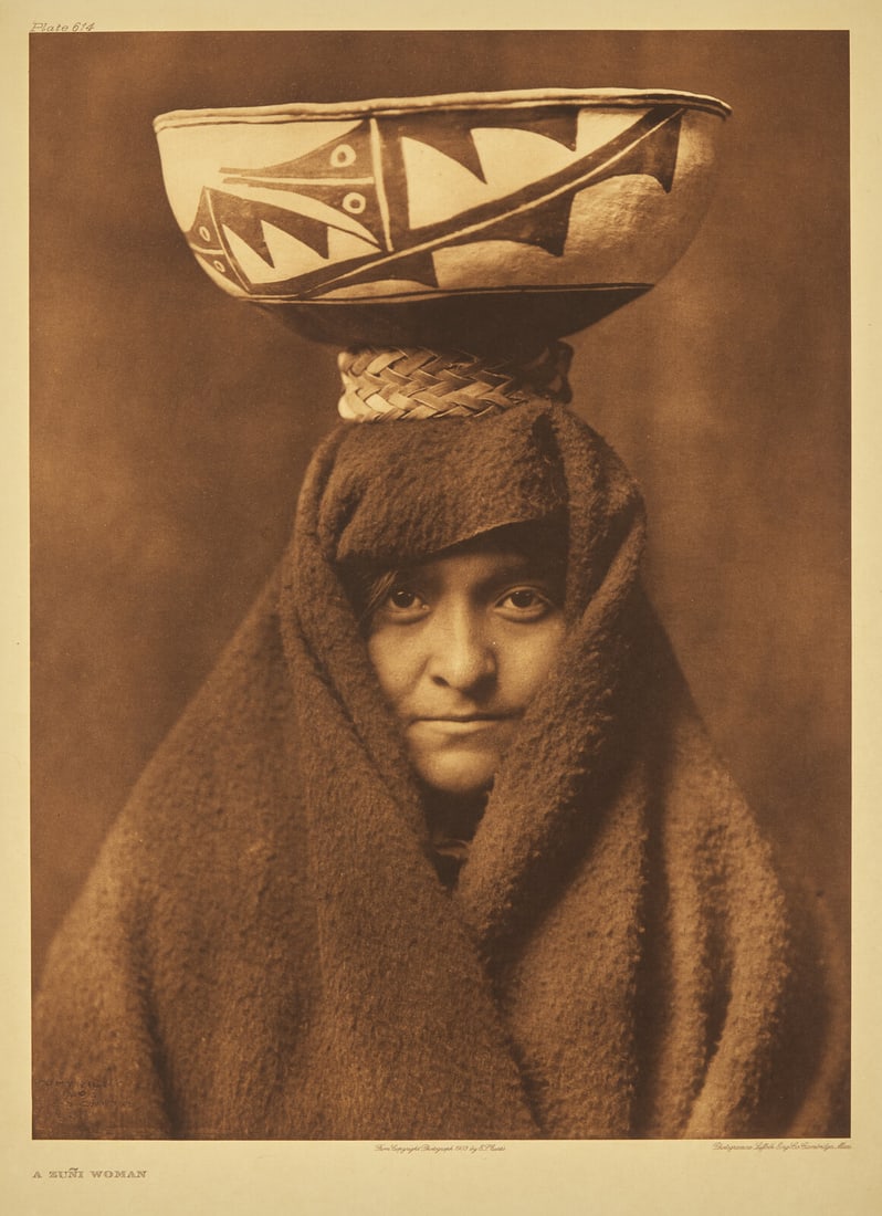 Edward Curtis (American, 1868-1952) A Zuni Woman, 1903: Edward Curtis (American, 1868-1952) A Zuni Woman, 1903 photogravure plate 614 on Japon vellum 22 x 18 inches (559 x 457 mm). This lot is located in Philadelphia. Provenance: From the Christopher G.