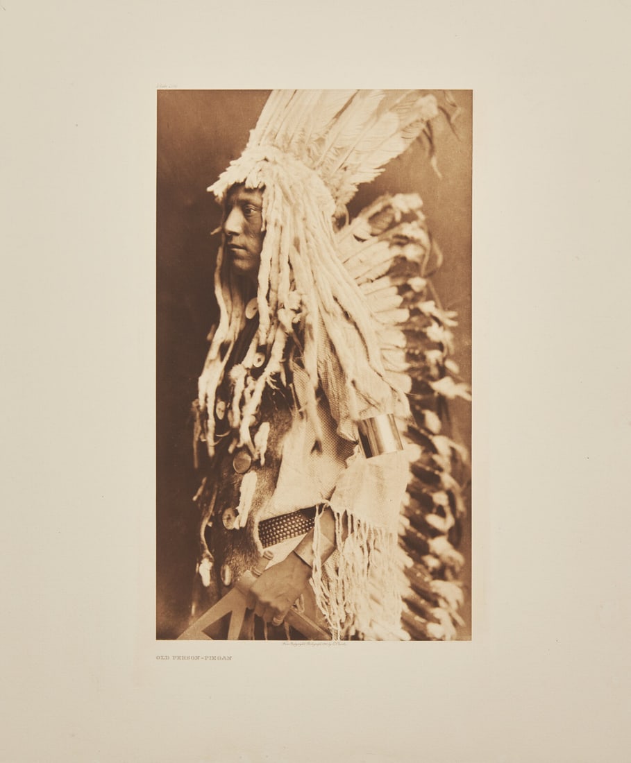 Edward Curtis (American, 1868-1952) Old Person - Piegan, 1911: Edward Curtis (American, 1868-1952) Old Person - Piegan, 1911 photogravure plate 204 on Holland Van Gelder paper 22 x 18-1/4 inches (559 x 463 mm) This lot is located in Philadelphia.