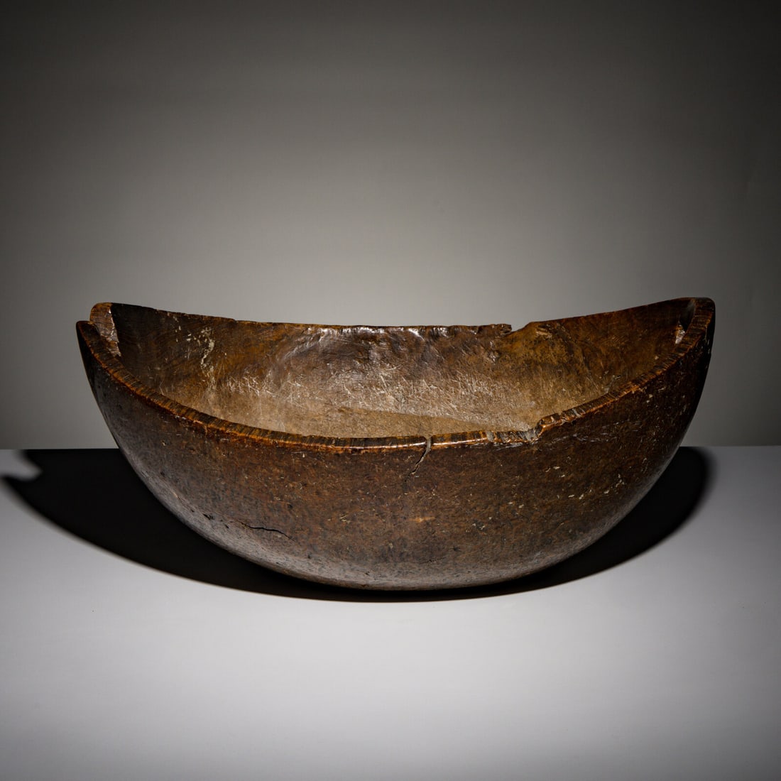 Eastern Woodlands Burl Bowl: Eastern Woodlands Burl Bowl early 19th century of large oval form; having two rectangular cutout handles; high-polish patina on exterior and along interior of rim from handling height 8 inches x