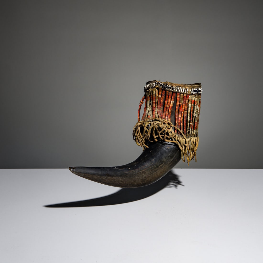 Sioux Quilled and Beaded Buffalo Horn Cup: Sioux Quilled and Beaded Buffalo Horn Cup third quarter 19th century large; having a band of quilled rawhide slat with a single beaded lane around the opening and fringe along lower slat edge length 1