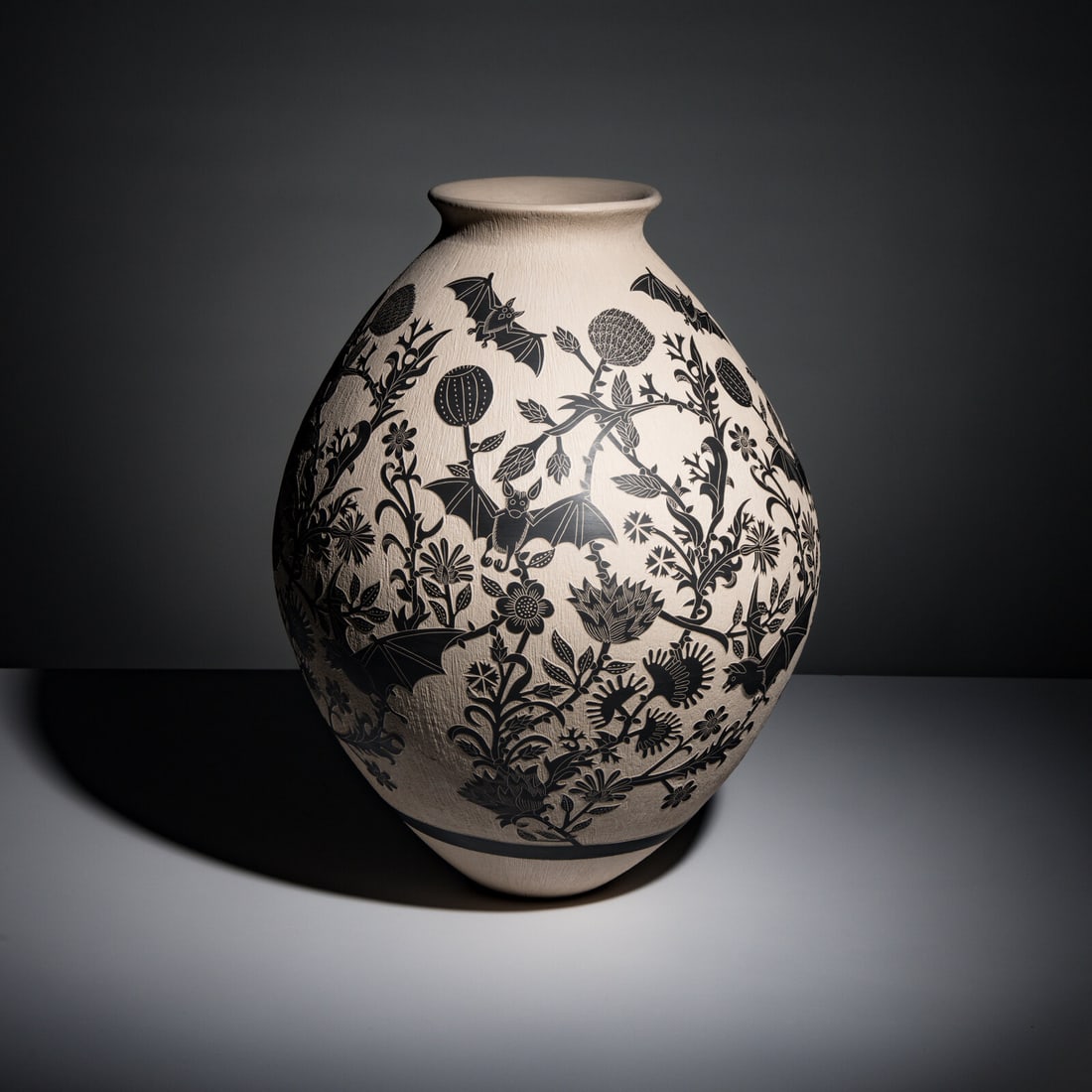 Adrian Corona Trillo (Mata Ortiz, b. 1987) Large Black-on-Cream Pottery Jar, with Bats: Adrian Corona Trillo (Mata Ortiz, b. 1987) Large Black-on-Cream Pottery Jar, with Bats designed with bats flying among flowering desert plants; signed near base height 16-1/2 inches x diameter 14 inch