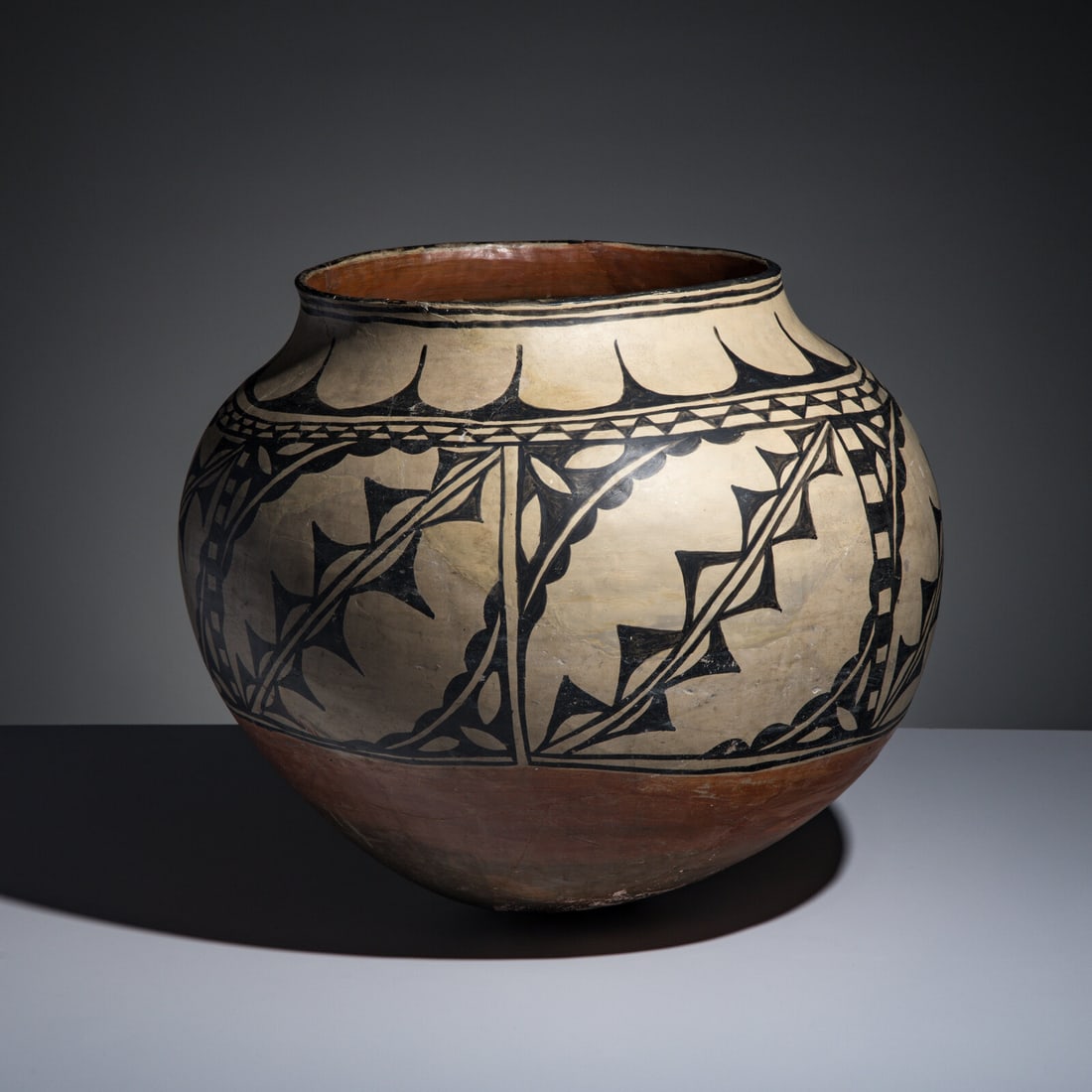Cochiti Pottery Storage Olla: Cochiti Pottery Storage Olla fourth quarter 19th century large, globular jar painted with angular and scalloped geometrics; rounded base height 17-3/4 inches x diameter 19-3/4 inches This lot is locat