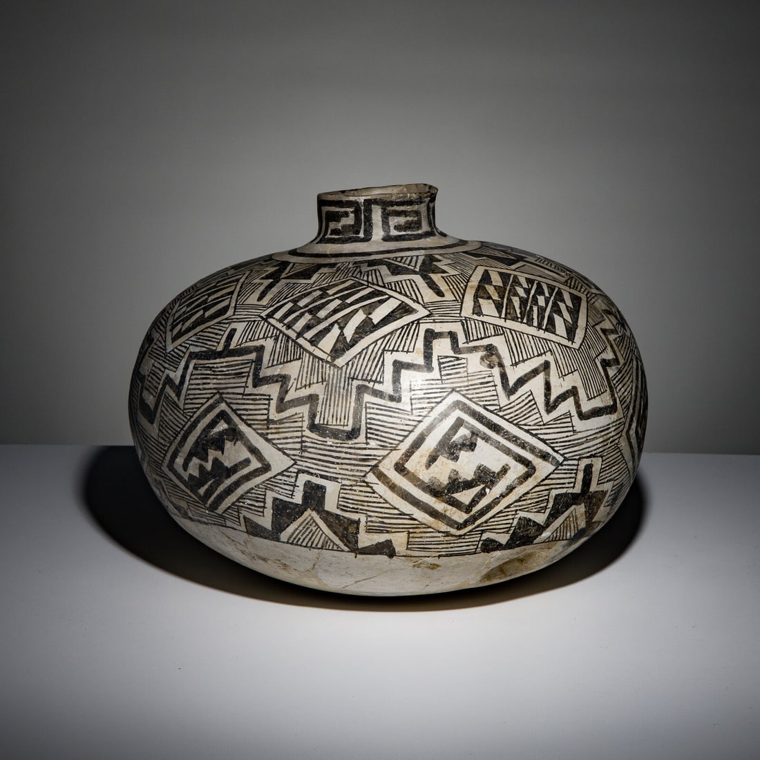 Tularosa Pottery Olla: Tularosa Pottery Olla pre-1500 having two indentations towards base height 12 inches x diameter 14 inches This lot is located in Chicago.