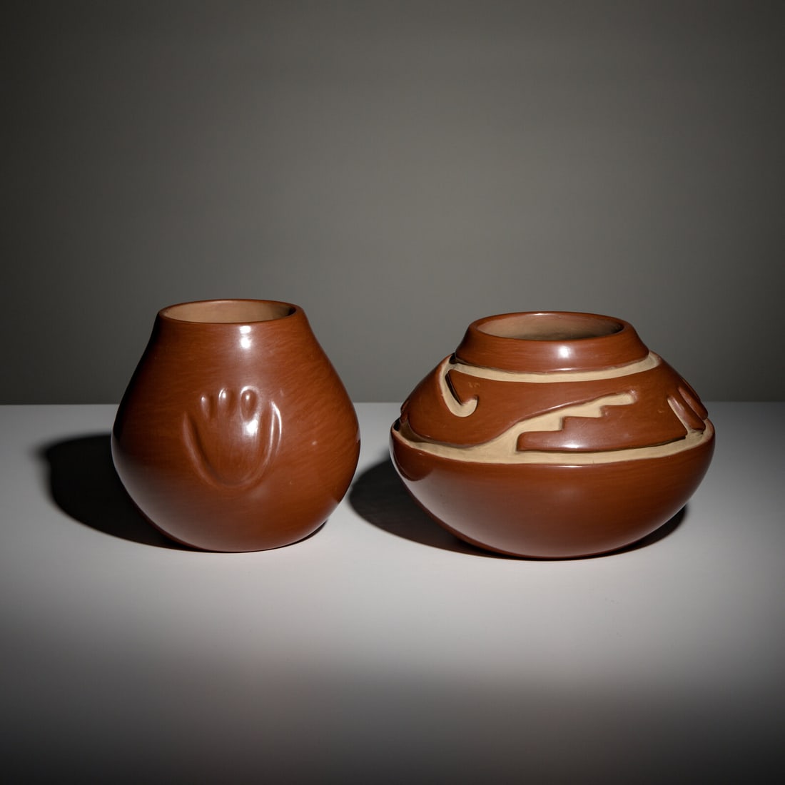 Margaret Tafoya (Santa Clara, 1904-2001) Redware Pottery: Margaret Tafoya (Santa Clara, 1904-2001) Redware Pottery lot of 2, both signed Margaret Tafoya, includes: a deeply carved jar with geometrics; height 5-1/2 inches x diameter 8-1/2 inches a jar with th