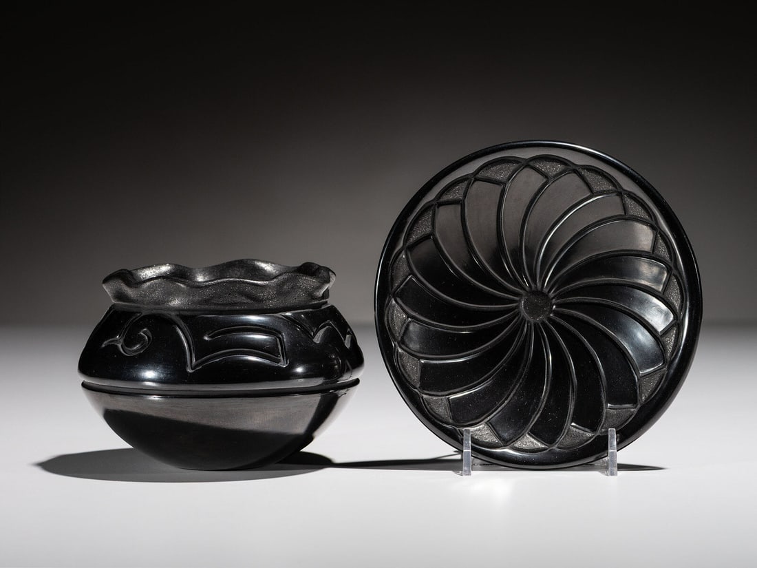 Linda Tafoya-Sanchez (Santa Clara, b. 1962) Micaceous Blackware Pottery: Linda Tafoya-Sanchez (Santa Clara, b. 1962) Micaceous Blackware Pottery lot of 2, includes: a plate with a floral pattern; signed on base, height 1 inches x diameter 6 inches a jar with a ruffled rim;