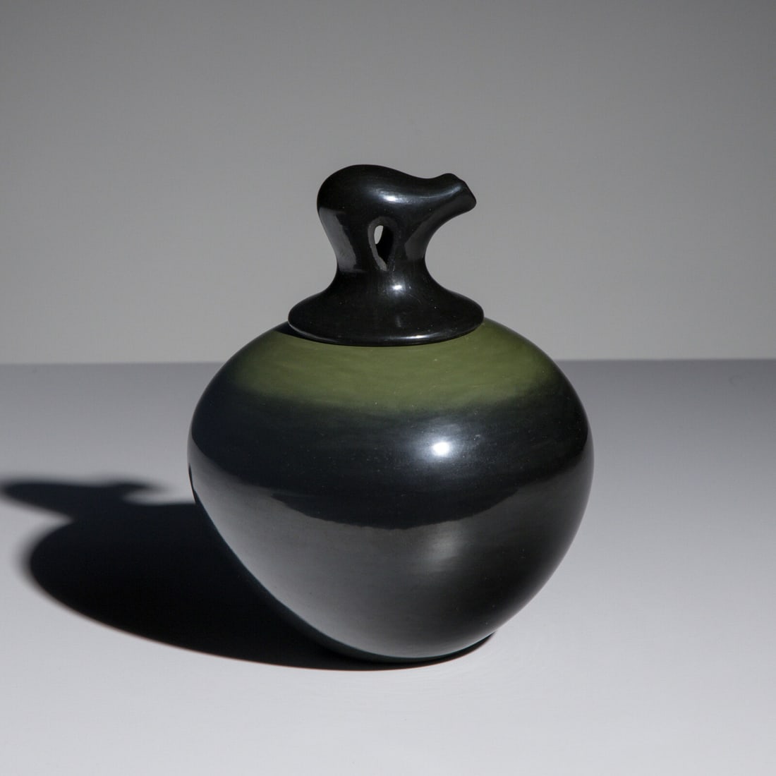 Russell Sanchez (San Ildefonso, b. 1963) Black and Green Pottery Jar, with Lid: Russell Sanchez (San Ildefonso, b. 1963) Black and Green Pottery Jar, with Lid signed on underside of lid and base height 4-3/4 inches x diameter 3-1/2 inches This lot is located in Chicago.