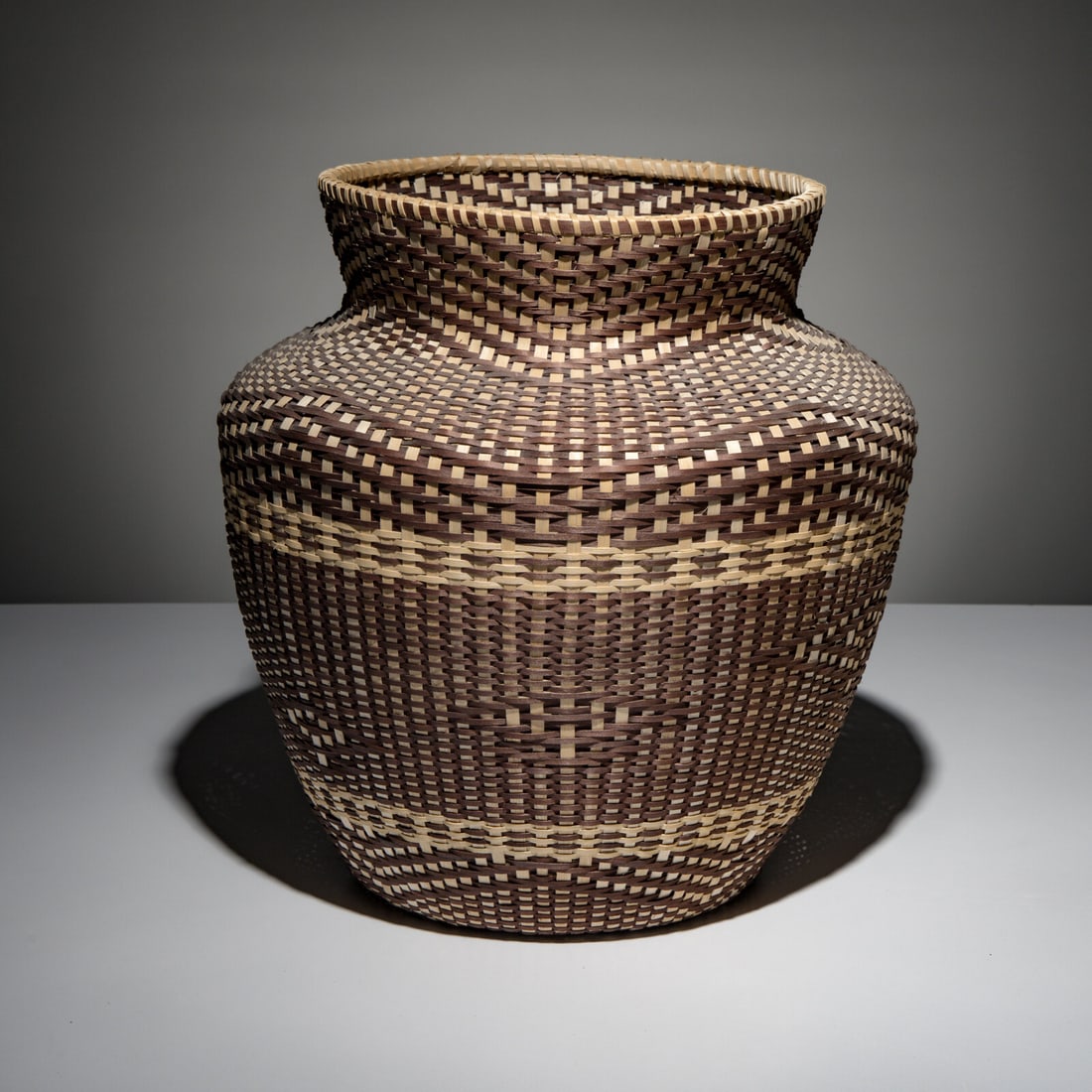 Fred Tomah (Maliseet, 1951-2018) Katahdin Series Basket, 2008: Fred Tomah (Maliseet, 1951-2018) Katahdin Series Basket, 2008 ash splints light and dark twill; signed and dated on base height 15-1/4 inches x diameter 15 inches Property from the Collection of John