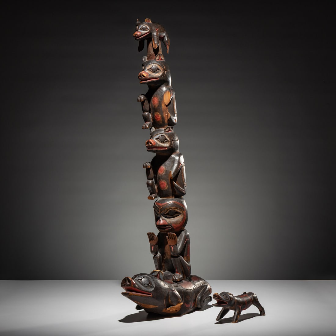 Haida Carved Totem Pole and Bear Cub: Haida Carved Totem Pole and Bear Cub fourth quarter 19th century lot of 2, includes: carved with three bears and a seated figure which have been pegged into a larger bear base; painted in black with b