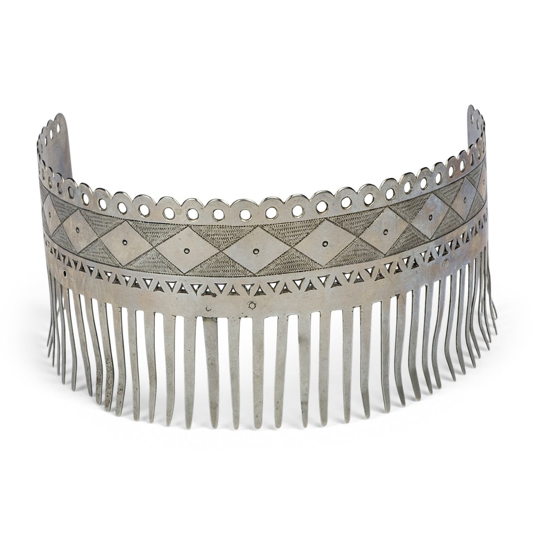 Menominee German Silver Hair Ornament: Menominee German Silver Hair Ornament ca 1900 having an etched and pierced geometric design height 2-3/4 inches x length 4 inches x width 5-1/4 inches cf. Material Culture of the Menominee Indians. In