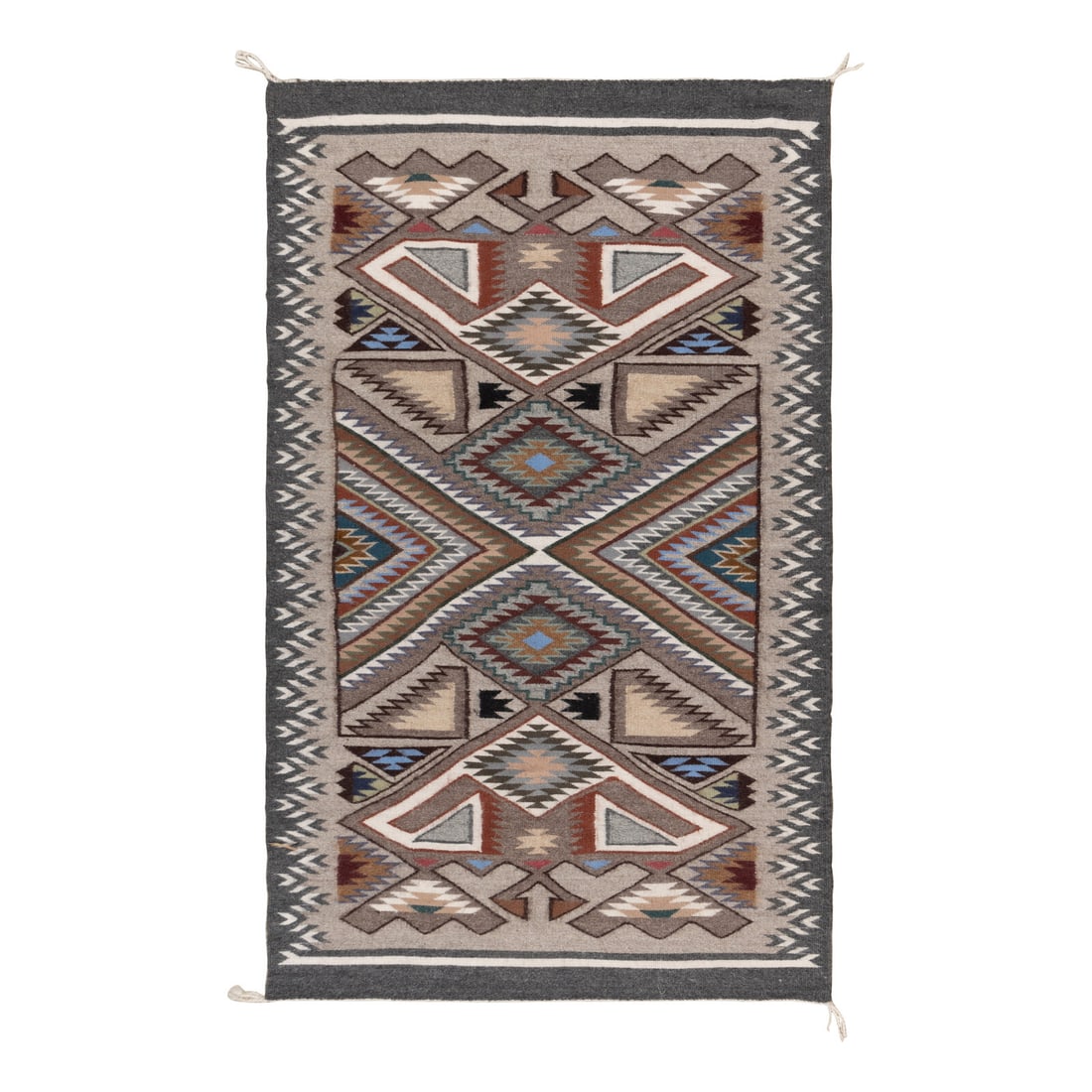Angela Begay (Diné, 20th century) Navajo Teec Nos Pos Weaving [Rug]: Angela Begay (Diné, 20th century) Navajo Teec Nos Pos Weaving [Rug] softly woven with a busy design in colors of grays, blue, gold, green, browns, and red 48 x 31 inches Property from the Collect