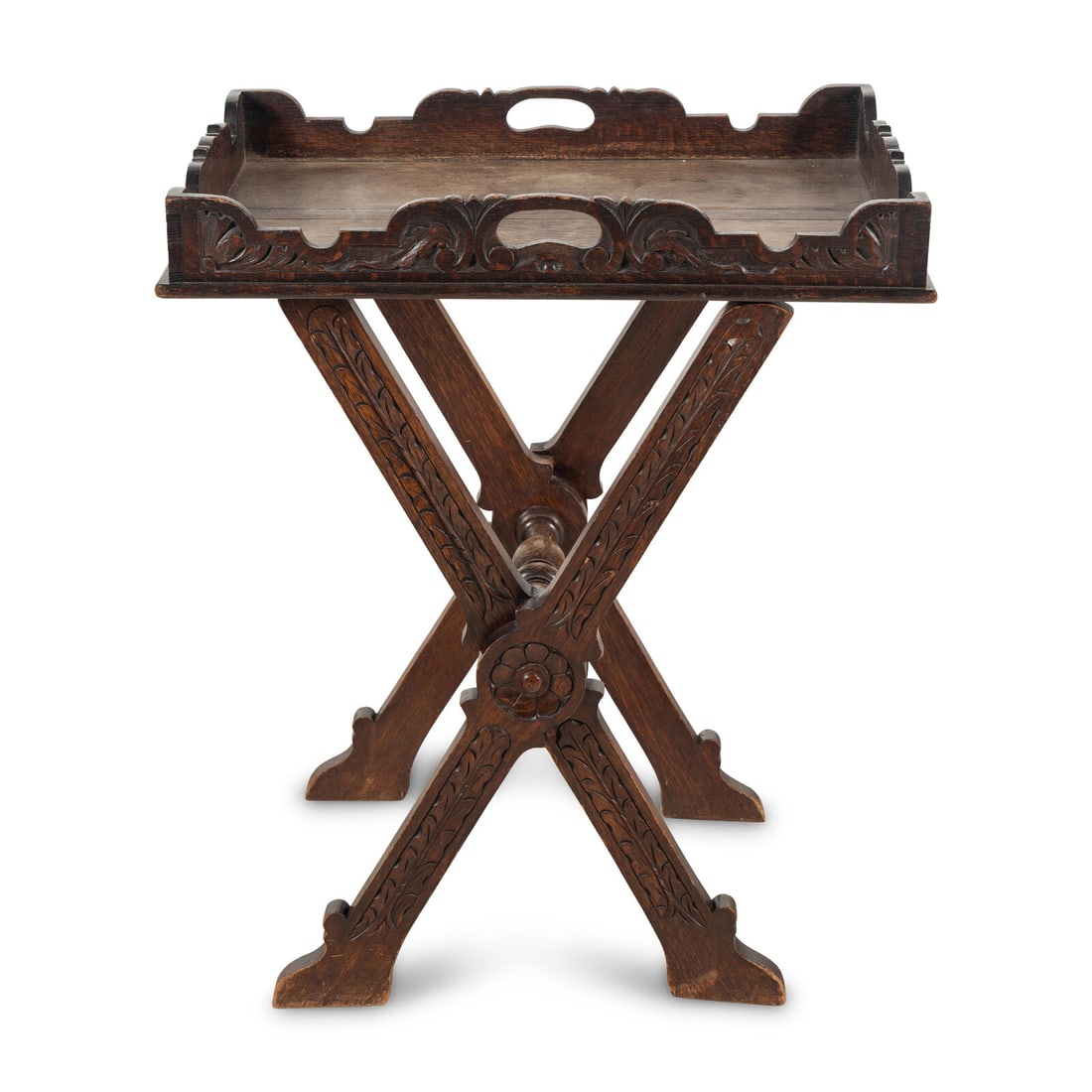 An Italian Carved Oak Butler's Tray and Stand: An Italian Carved Oak Butler's Tray and Stand Late 19th Century Height overall 33 1/2 x width 28 3/4 x depth 19 inches. Property from a Utah Mountain Residence This lot is located in Chicago.