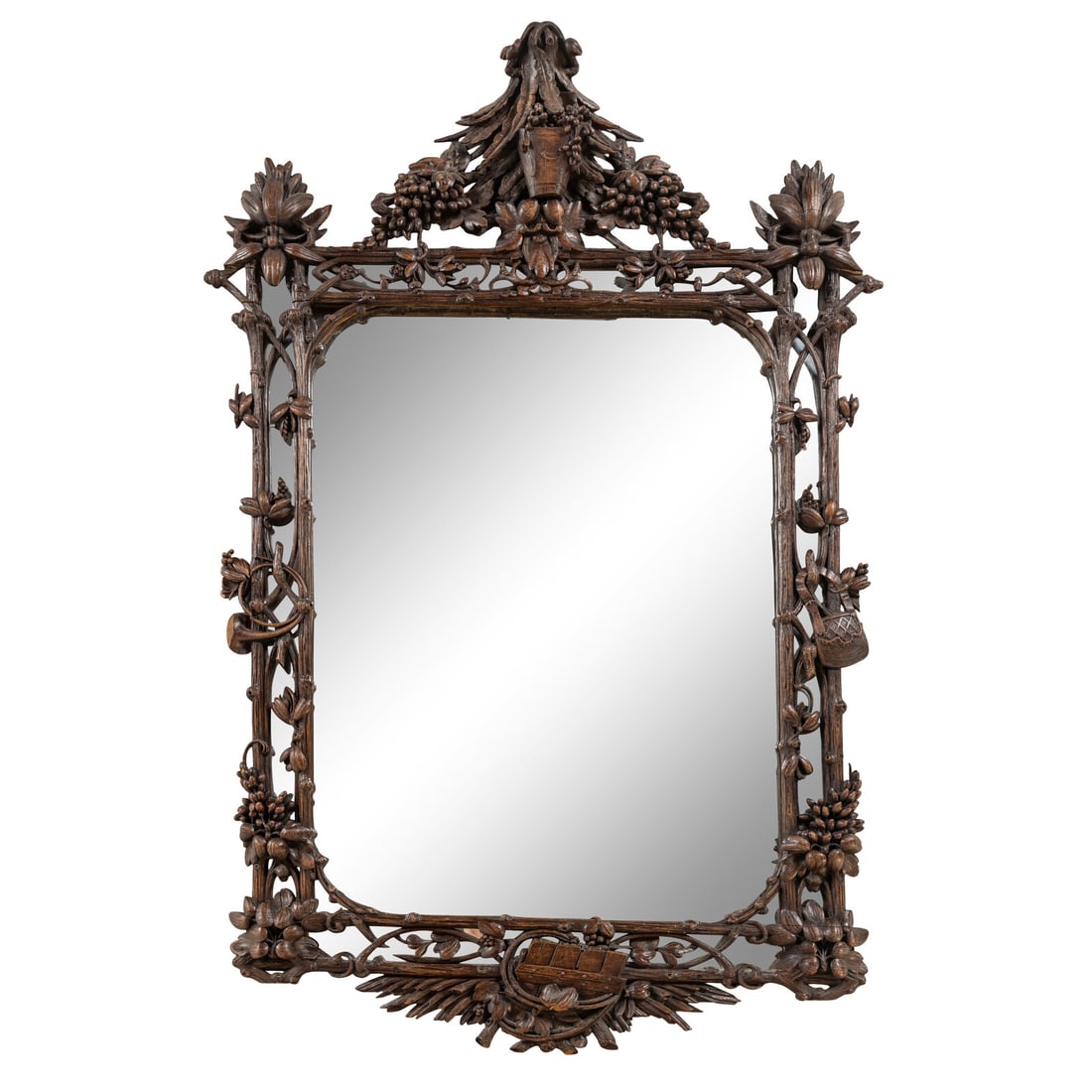 A Swiss "Black Forest" Carved Oak Mirror: A Swiss "Black Forest" Carved Oak Mirror Late 19th Century Height 61 x width 40 inches. Property from a Utah Mountain Residence This lot is located in Chicago.