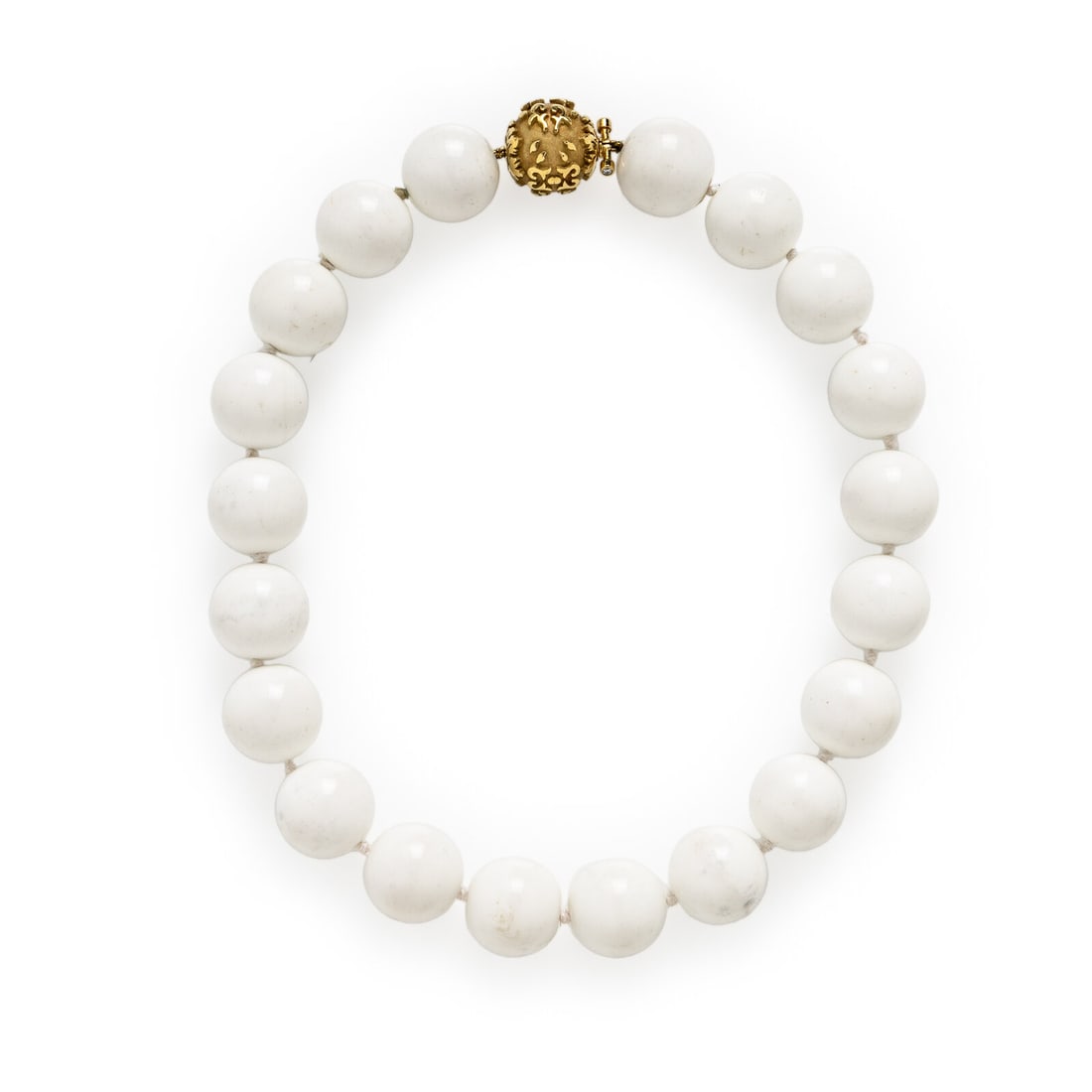Yellow Gold and Cacholong Bead Necklace: Yellow Gold and Cacholong Bead Necklace Cacholong beads measuring approximately 19.75 - 20.00 mm and two round brilliant cut diamonds. Yellow gold. 18 inches long. Gross weight: 140.80 dwt, Property f