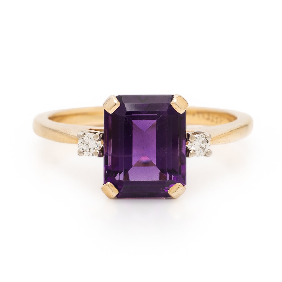 Amethyst, Diamond, and Yellow Gold Ring: Amethyst, Diamond, and Yellow Gold Ring Emerald cut amethyst and round brilliant cut diamonds. Yellow gold. Ring size 6. Stamp: 669 (obscured). Gross weight: 1.85 dwt.
