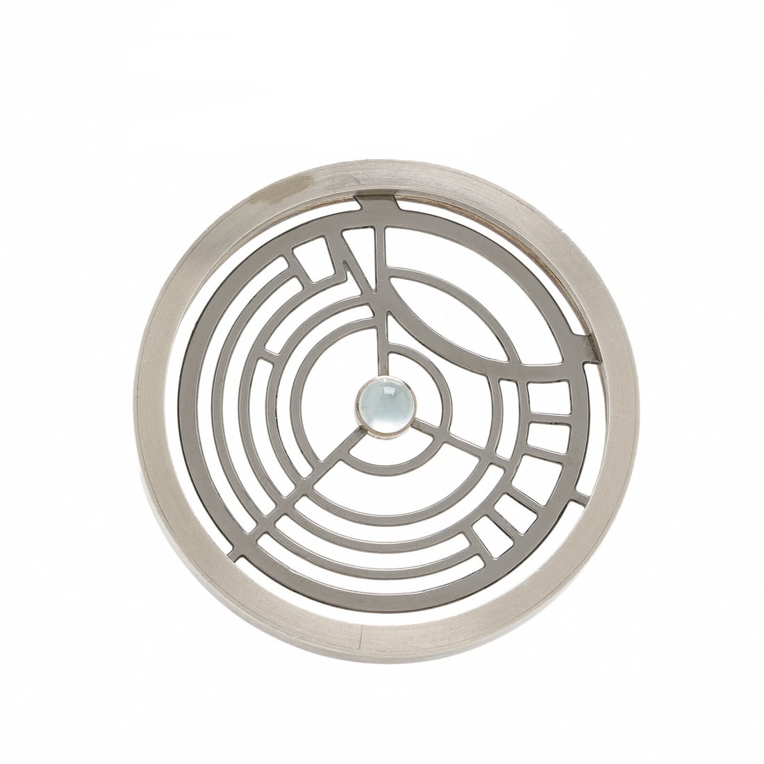 Wendy Ramshaw, White Metal and Moonstone Brooch: Wendy Ramshaw, White Metal and Moonstone Brooch Round cabochon moonstone. White metal. 2 x 2 inches. Gross weight: 23.10 dwt. Property from a Private Collection Provenance: Acquired directly from the 