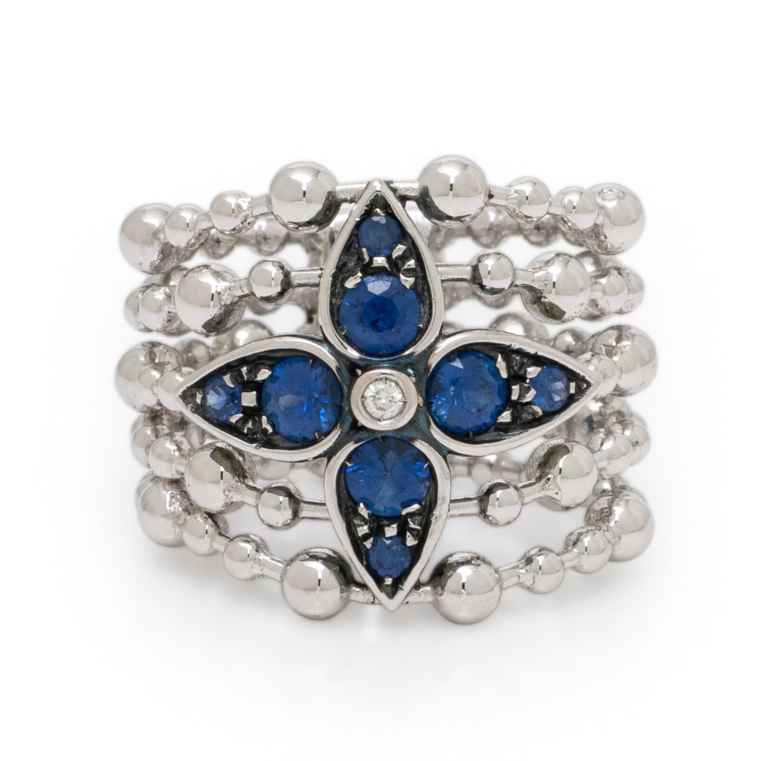 Sapphire, Diamond, and White Gold Ring: Sapphire, Diamond, and White Gold Ring Round brilliant cut diamond and round sapphires. 18 karat white gold. Ring size 6. Stamp: 750 (Italian maker's mark). Gross weight: 8.20 dwt. Property from the C