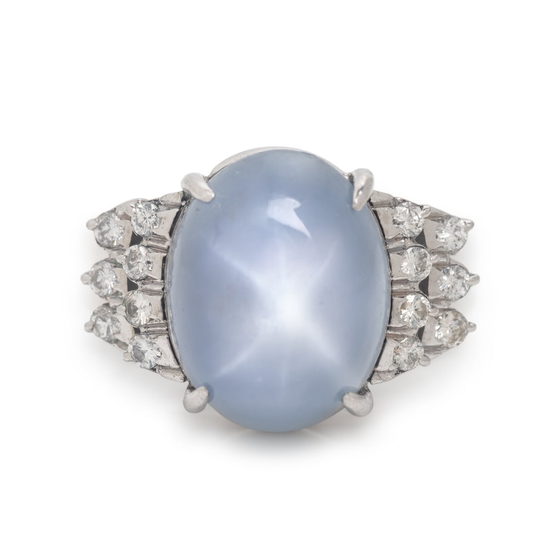 Star Sapphire, Diamond, and White Gold Ring: Star Sapphire, Diamond, and White Gold Ring Oval cabochon star sapphire measuring approximately 12.60 x 9.90 mm and round brilliant cut diamonds. 18 karat white gold. Ring size 5 3/4. Stamp: 18K Gross