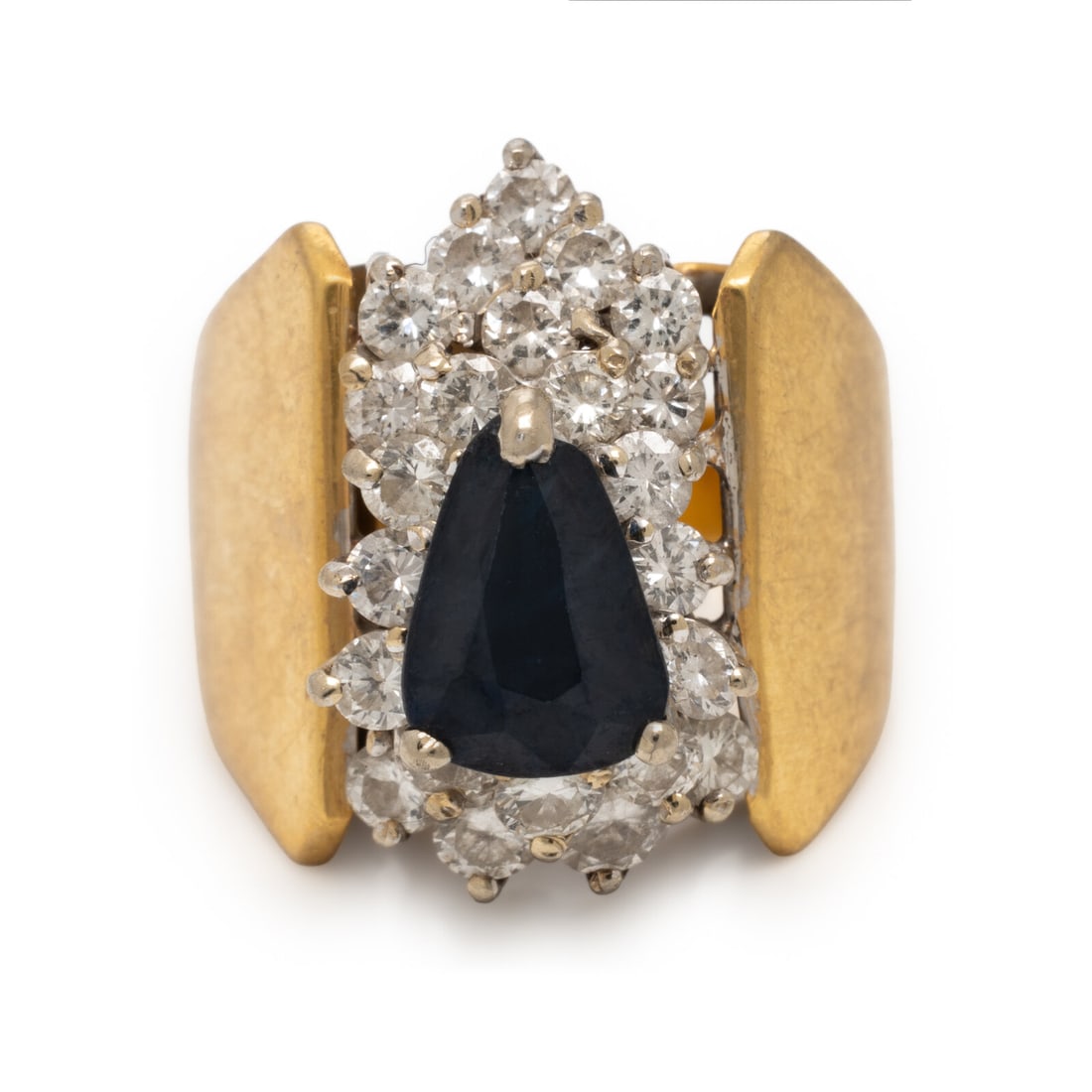 Sapphire, Diamond, and Yellow Gold Ring: Sapphire, Diamond, and Yellow Gold Ring Pear shape sapphire measuring approximately 7.70 x 5.50 mm and round brilliant cut diamonds weighing approximately 0.65 carat total. 18 karat yellow gold. Ring