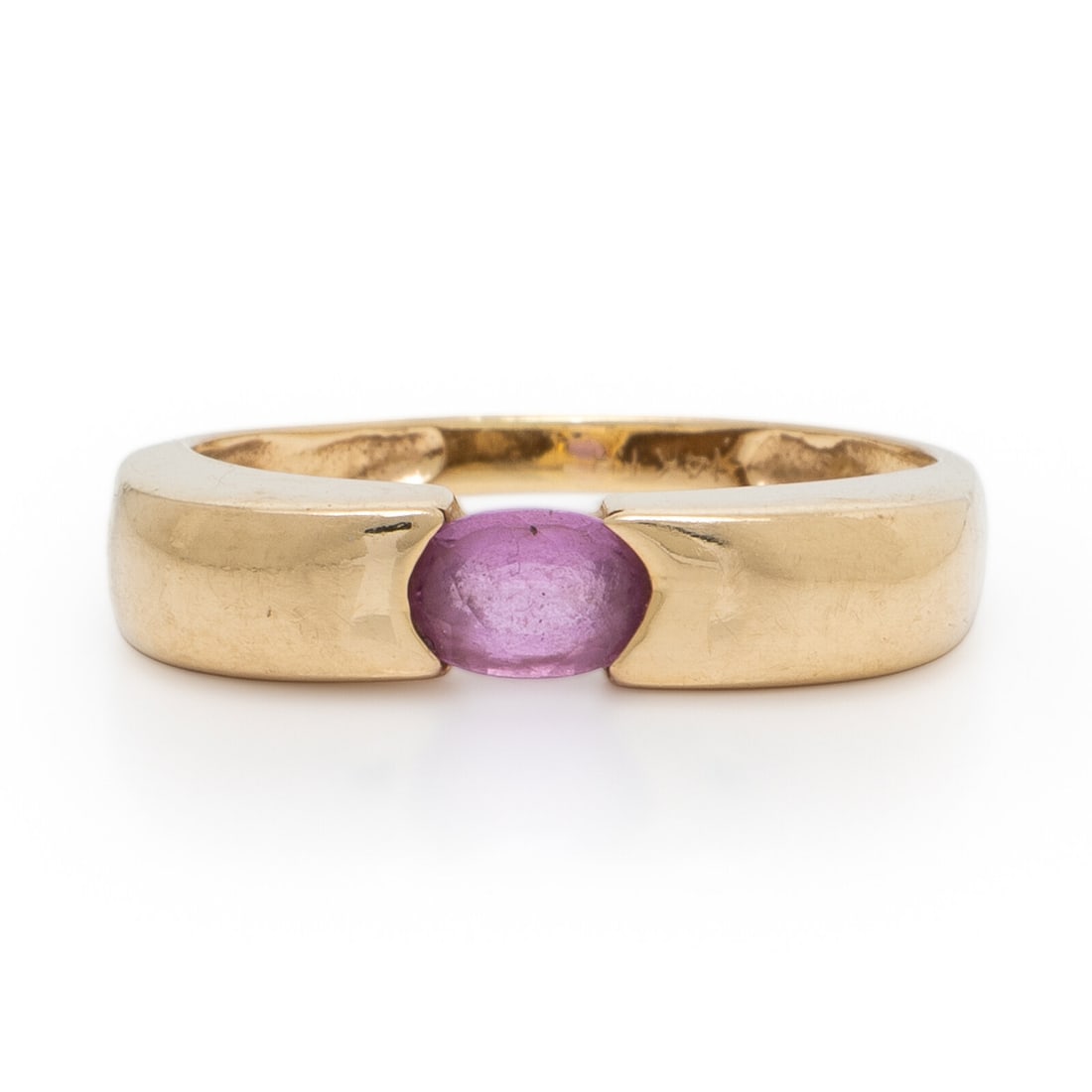 Yellow Gold and Pink Sapphire Ring: Yellow Gold and Pink Sapphire Ring Oval pink sapphire. 14 karat yellow gold. Ring size 6 3/4. Stamp: 14K NH. Gross weight: 1.90 dwt.