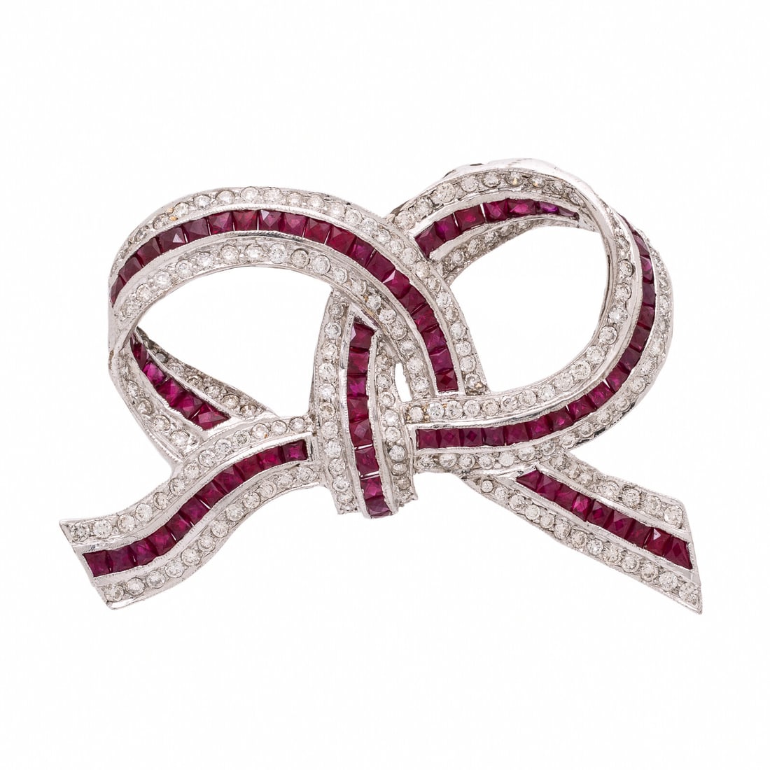 Ruby, Diamond, and White Gold Bow Brooch: Ruby, Diamond, and White Gold Bow Brooch Round brilliant cut diamonds weighing approximately 1.45 carats total, and French cut rubies. 18 karat white gold. 1 3/4 x 1 1/8 inches. Stamp: 750. Gross