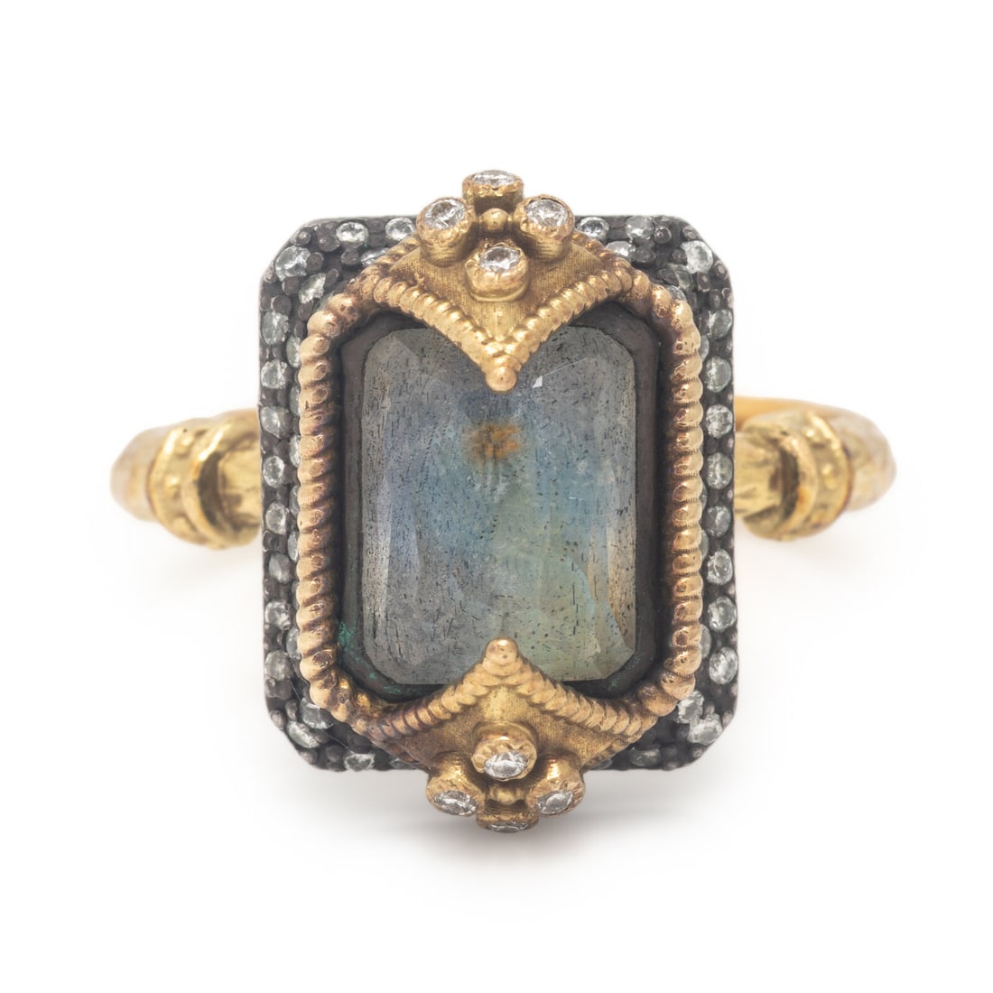 Labradorite, Diamond Ring, Silver, and Yellow Gold Ring: Labradorite, Diamond Ring, Silver, and Yellow Gold Ring Reverse set emerald mixed cut labradorite measuring approximately 9.25 x 7.40 x 4.40 mm and round brilliant cut diamonds. Yellow gold and silver